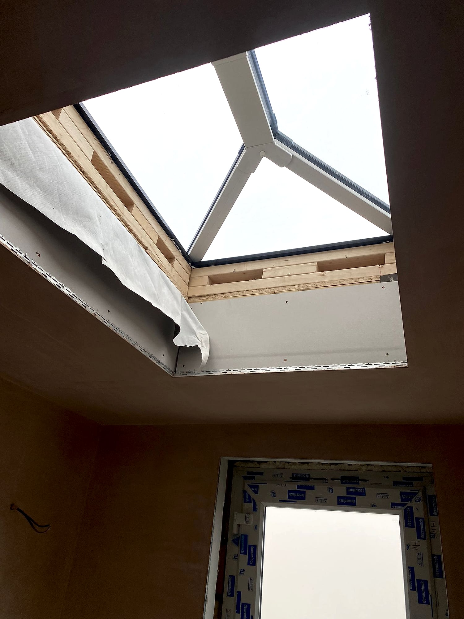 Extension ceiling plastered around roof lantern skylight with new door fitted in East Kent home renovation