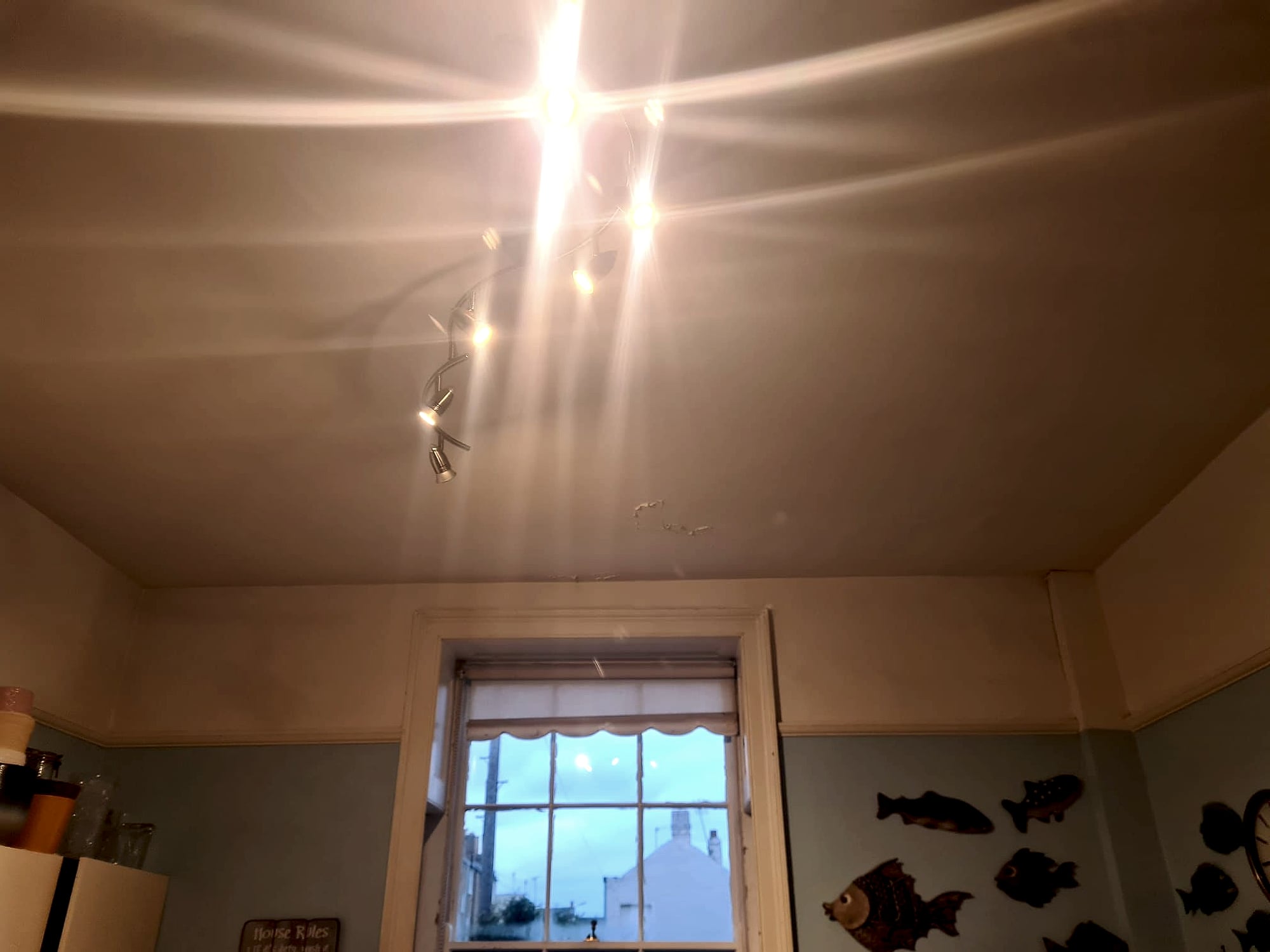 Completed kitchen ceiling skim coat with spot lights and smooth finish in decorated East Kent home