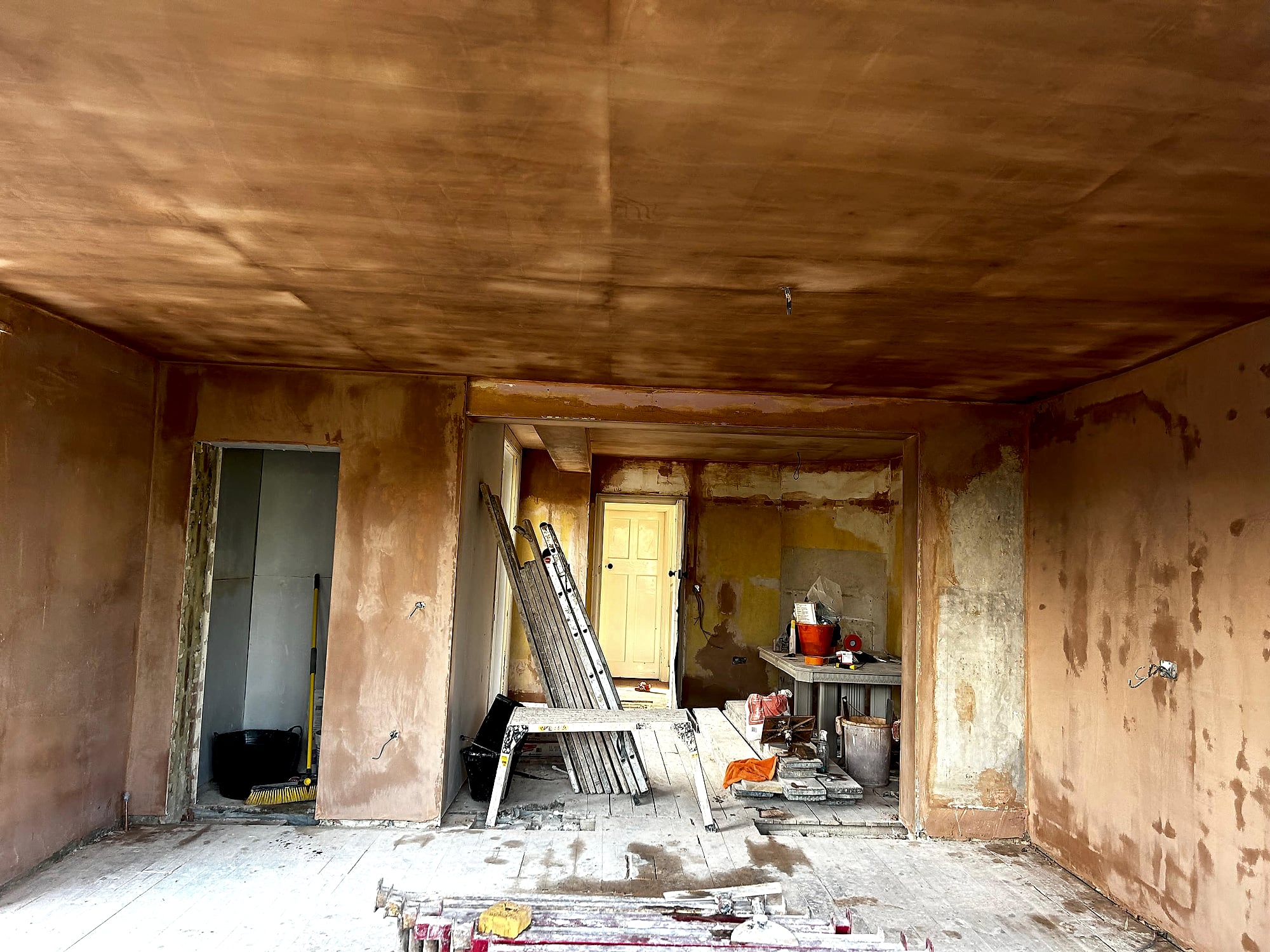Victorian house full room plastering showing fresh skim on walls and ceiling with equipment in Kent renovation