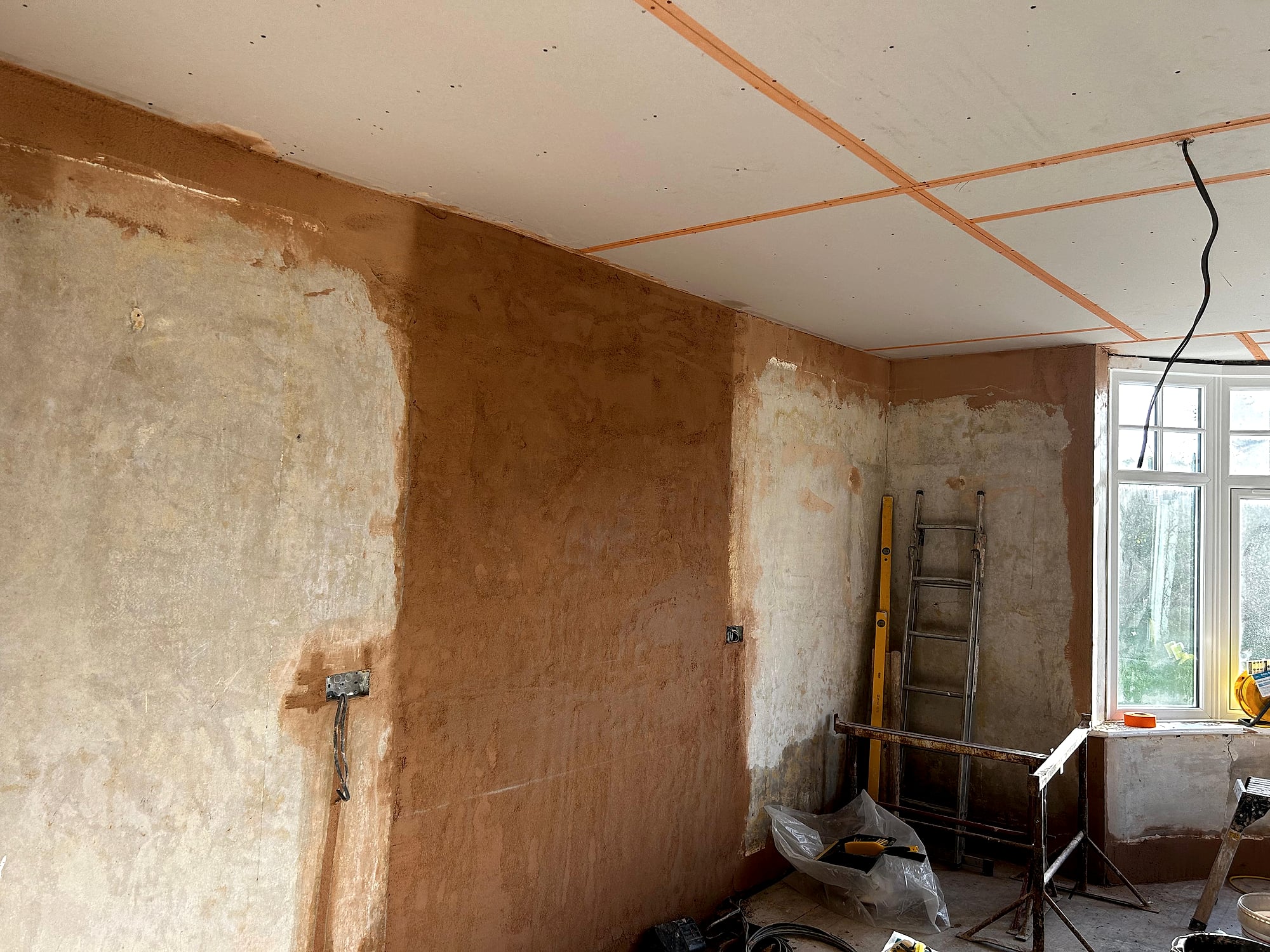 Victorian house walls being re-plastered with plasterboard ceiling and bay window in Kent renovation project