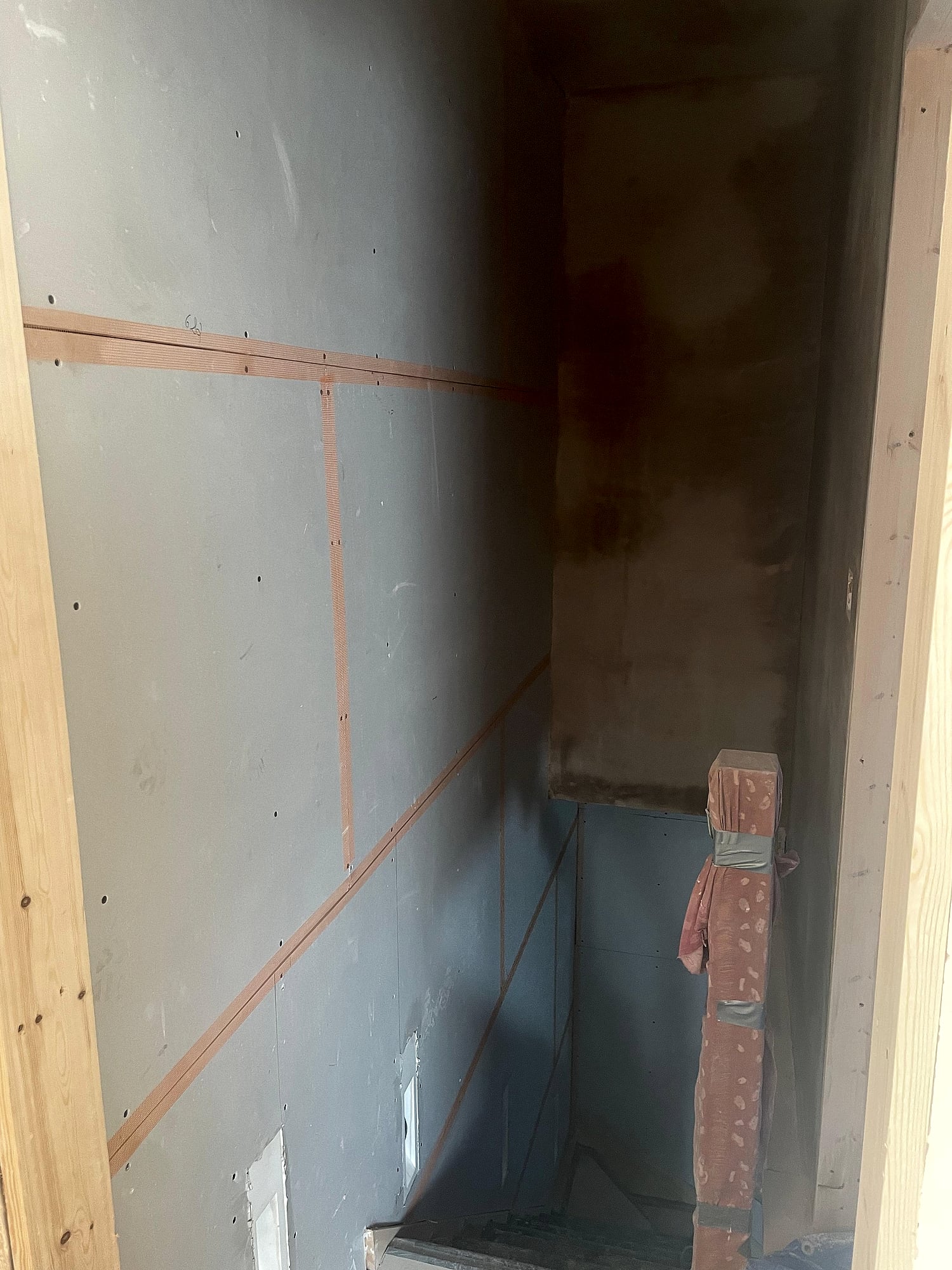 Large Victorian room with full skim coat on walls and ceiling showing fireplace alcove in East Kent